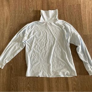 Blue turtleneck top
(Great for layering)